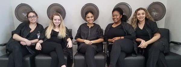 Cosmetology students relax during a break in class time